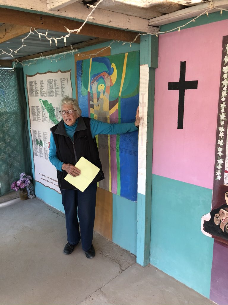 Sister of Mercy Betty Campbell of Casa Tabor in Ciudad Juárez, explains hand-written murals depicting victims of violent deaths in Latin America